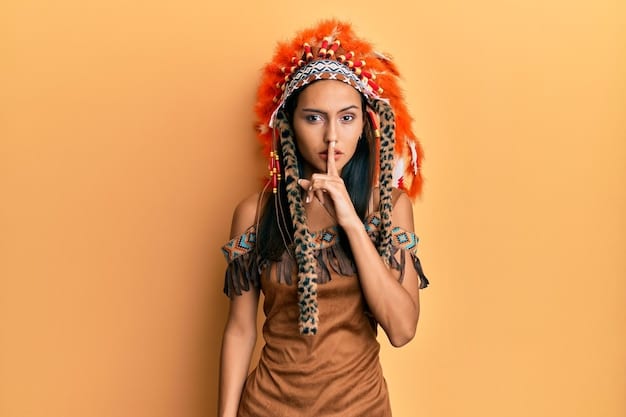 A person wearing Native American headdress as a costume, with a disrespectful or mocking expression. The image highlights the misuse of sacred cultural symbols and the insensitivity of cultural appropriation.
