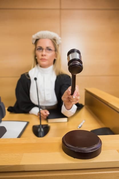 A gavel striking a sound block inside a courtroom. Focus on the gavel and sound block, with the American flag blurred in the background. This symbolizes the legal proceedings and decisions related to affirmative action.