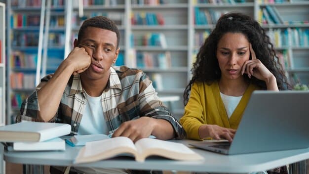 Students of different ethnic backgrounds looking confused and frustrated while taking a practice standardized test in a dimly lit, outdated classroom. The image should highlight the challenges faced by minority students due to cultural biases in test content.