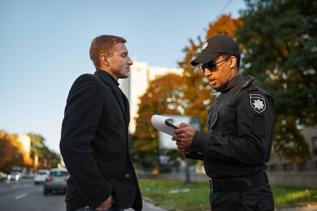 A police officer wearing a body camera while interacting with a member of the public. The scene is professional and demonstrates the use of technology for accountability and transparency.