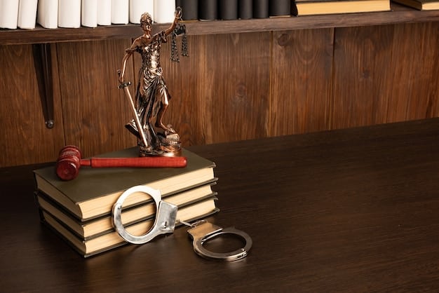 A gavel resting on a stack of law books in a courtroom symbolizing the legal system and hate crime legislation.