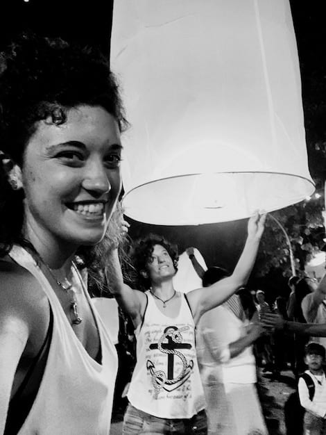 A black and white photograph from the Civil Rights Era, showing civil rights activists marching for voting rights. The marchers are holding signs and banners that read 