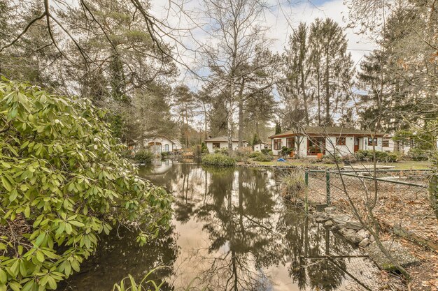 A photo showing a flooded low-income neighborhood after a hurricane, with residents wading through the water and damaged homes in the background. The image highlights the vulnerability of these communities to extreme weather events intensified by climate change.