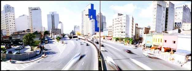A split image showing two different neighborhoods, one with well-maintained streets and ample resources, and the other with dilapidated buildings and limited access to basic amenities, illustrating socioeconomic disparities.