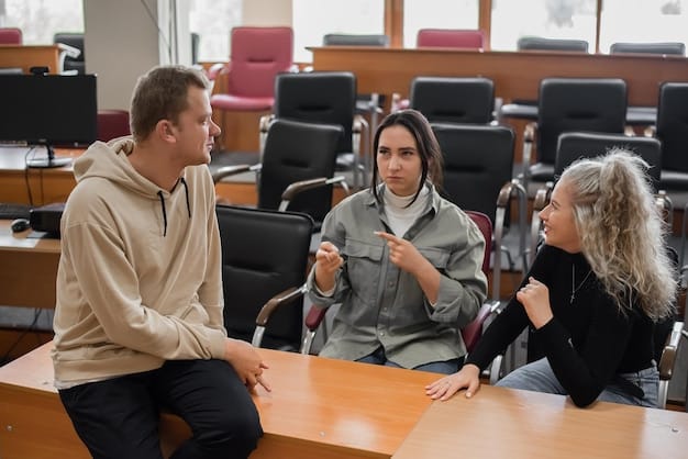 Undocumented students in a classroom, actively participating in a discussion with their professor. The setting is a university or college, emphasizing the importance of higher education.