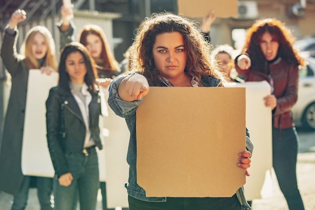 A photograph of a diverse group of people participating in a peaceful protest. They are holding signs and banners advocating for social justice and equality.