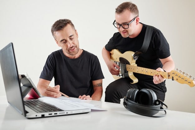A musician receiving an email on their laptop, with a celebratory expression. The email appears to be from a music supervisor offering a placement.