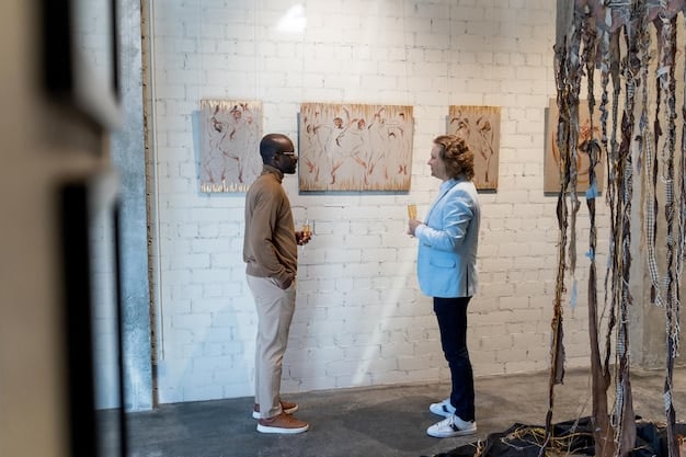 A well-lit art gallery in Chelsea, New York, featuring contemporary paintings on white walls. People are seen observing and discussing the artwork. The ambiance is sophisticated and modern.